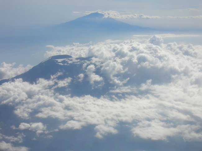 Mt. Kilimanjaro (Uhuru) foreground; Mt. Meru Background